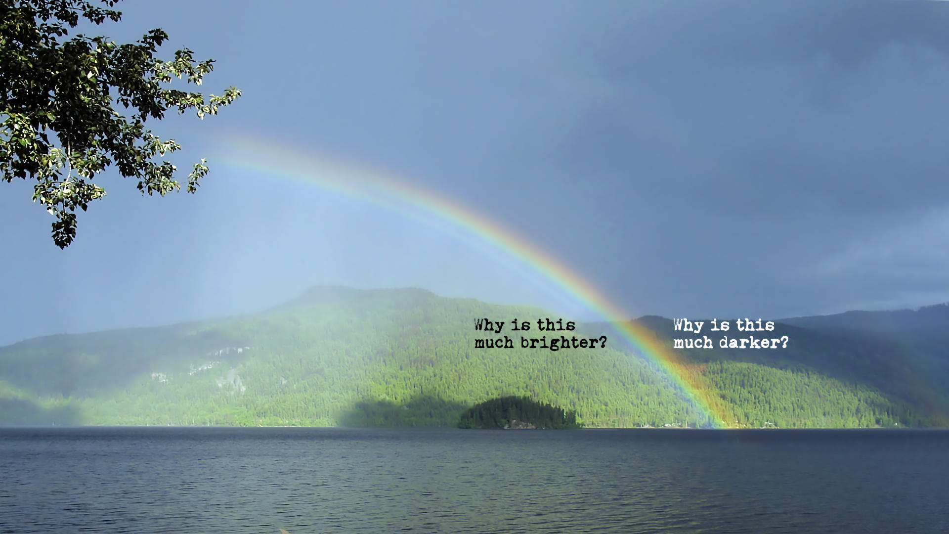 A double rainbow over a landscape, showing the distinct dark sky between the primary and secondary arcs known as Alexander's band.
